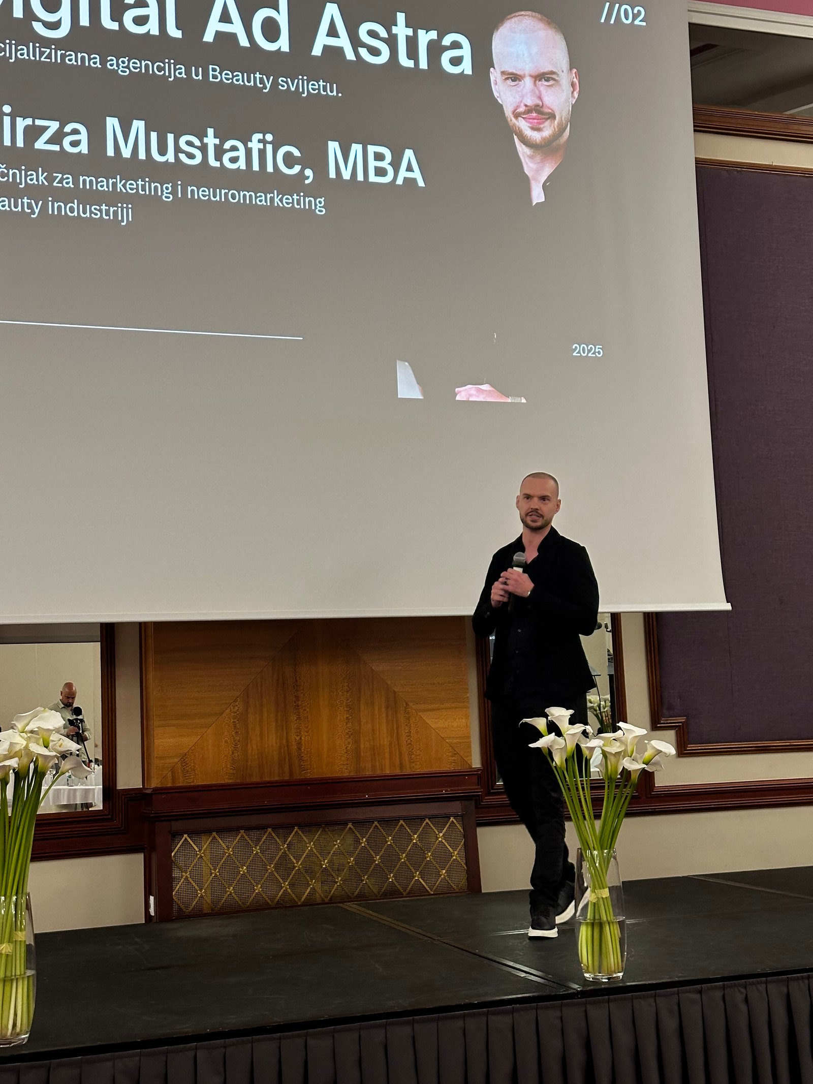 Mirza Mustafic, founder of Digital Ad Astra, speaking on stage